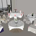 Multiple Round Dining Table Set with White Tablecloths Floral Centerpieces and Pink Ribbon Chair Covers