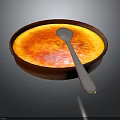 Delicious Creme Brulee With Caramelized Top In Brown Bowl And Silver Spoon