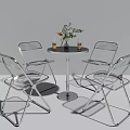 Transparent Dining Table And Chairs Set With Metal Frame And Green Plant Decor