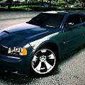 Stylish Dark Gray Muscle Car With Sporty Exterior Design And Shiny Alloy Wheels