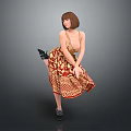 Woman With Short Brown Hair Posing In Patterned Dress Lifting One Leg On Gray Background