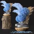 Blue Hydrangea and Pampas Grass in Striped Glass Vase with Wooden Base on Tree Stump