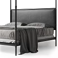 Modern Four Poster Double Bed With Upholstered Headboard And Striped Bed Linens