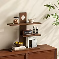 Wooden Three Tier Shelf Displaying Glass Jar Grains White Bowl Clock Candles Books and Fruits