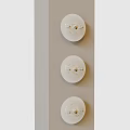 Three White Circular Wall Decor Pieces Arranged on Light Gray Wall with Metal Accents