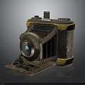 Vintage Folding Camera Equipment With Brass Body Yellow Trim Intricate Carved Patterns And Blue Lens