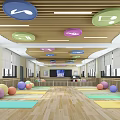 Indoor fitness workout space with ceiling round decor and colorful exercise balls on wooden floor