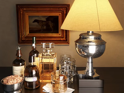 Wine Bottles and Glasses on Wooden Table with Table Lamp Picture Frame and Nut Bowl 3d model
