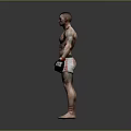 Muscular Shirtless Man With Tattoos In Black Boxing Gloves Red White Shorts Against Gray Background