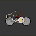 Vintage Tricycle With Red Upholstered Seat Black Frame And Gold Decorative Accents