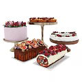 Assorted Desserts On Stands With Purple Cake Cupcakes Fruit Topped Loaf And Swiss Roll