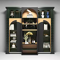 Stylish Dark Green Decorative Cabinet Featuring Multiple Compartments With Ballet Figurines Books And White Flowers