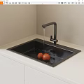 Modern Kitchen Black Washing Sink with Running Water Faucet and Oranges on White Countertop