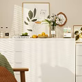 White Dresser In Bright Living Room With Sunlight And Decorative Items On Top