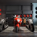 Red And Black Motorcycles In Garage Showroom With Tire Decor And Shelves