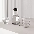 Clear Drinking Glasses Filled With Water And Transparent Bottle On Light Table White Curtain