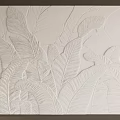 White Background Wall with Embossed Leaf Pattern and Modern Textured Decorative Design