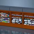 Wooden Three Section Bookcase With Multiple Shelves And Colorful Books On Gray Top
