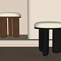 Modern Minimalist Stools With Upholstered Seats Brown And Black Wooden Legs In Soft Light Interior