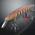 Fish Shaped Fishing Lure With Red Brown Body Black Stripes Yellow Eyes And Metal Hooks