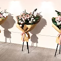 Floral Display With Paper Wrapped Bouquets Pink Ribbons And Tripod Stands