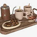 Two Mugs With Wooden Spoons On Wooden Tray Alongside Coffee Pot Cookies And Chocolate Bar