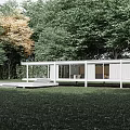 Modern White Single-family House With Large Glass Windows and Lush Green Trees