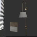 Modern Wall Lamp With Linen Shade Mounted On Gray Wall And Artwork Near Window Blinds