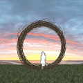 Round Woven Outdoor Chair Placed on Green Grass Field Facing Beautiful Sunset Sky