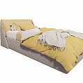 Single Bed with Light Gray Headboard Yellow Quilt White Pillows and Gray Blanket