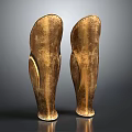 Two Shiny Golden Metallic Leg Armor With Curved Design And Glossy Finish