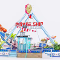 Vibrant Pirate Ship Amusement Ride with Red Sign Palm Trees and Lighthouse Decor
