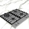 Modern Kitchen Cabinets With Integrated Gas Stove Black Grates And Marble Countertop