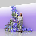 Commercial Large Floral Display Equipment With Various Colored Flowers And Woman Standing By