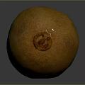 Fresh Ripe Yellow Oval Shaped Kiwi Fruit With Brown Spots On Dark Background