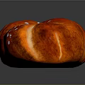Delicious Braided Bread Loaf With Glazed Red Brown Surface And Sugar Topping