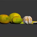 Fresh Whole and Sliced Citrus Fruits Arranged on Black Reflective Surface
