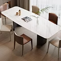 Modern Dining Table Set With Marble Top Mixed Color Chairs Green Plant And Magazine