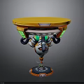 Vibrant Mechanical Round Table With Yellow Tabletop And Green Orange Accents
