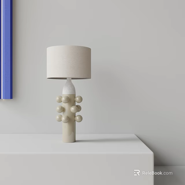Beige Linen Shade Table Lamp With White Ceramic Base Round Decorative Balls On White Tabletop 3d model 