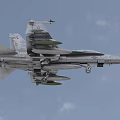 US Navy Fighter Jet Flying in Cloudy Sky With Landing Gear Down and Mounted Missiles