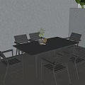 Black Outdoor Table with 6 Chairs Set in Gray Wall Patio Area