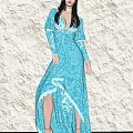 Woman in Blue Long Dress With Long Sleeves V Neck Lace Asymmetrical Hem Light Wall