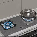Black Gas Stove With Two Blue Flames And Pan On Burner Countertop