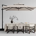 Outdoor Dining Table with Patio Umbrella Decorative Vase Branches and Wooden Chairs Setup