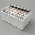 Display Cabinet With Marble Base Glass Top And Neatly Arranged Small Red Logo Items