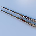 Two Elegant Decorative Wands With Intricate Carved Handles And Metal Accents