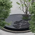 Garden Scene With Circular Black Rockery Stone Surrounded By Green Trees Grass And Paved Ground