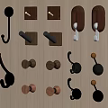 Various Decorative Wall Hooks With Diverse Shapes And Materials On Wooden Background