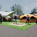 Outdoor RV Camping Area With Tents People Trees And Solar Panels